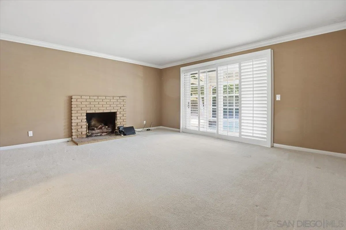 1262 Brittany Cross Road North Tustin, CA 92705 - Photo 29 of 35 an empty room with furniture and a fireplace