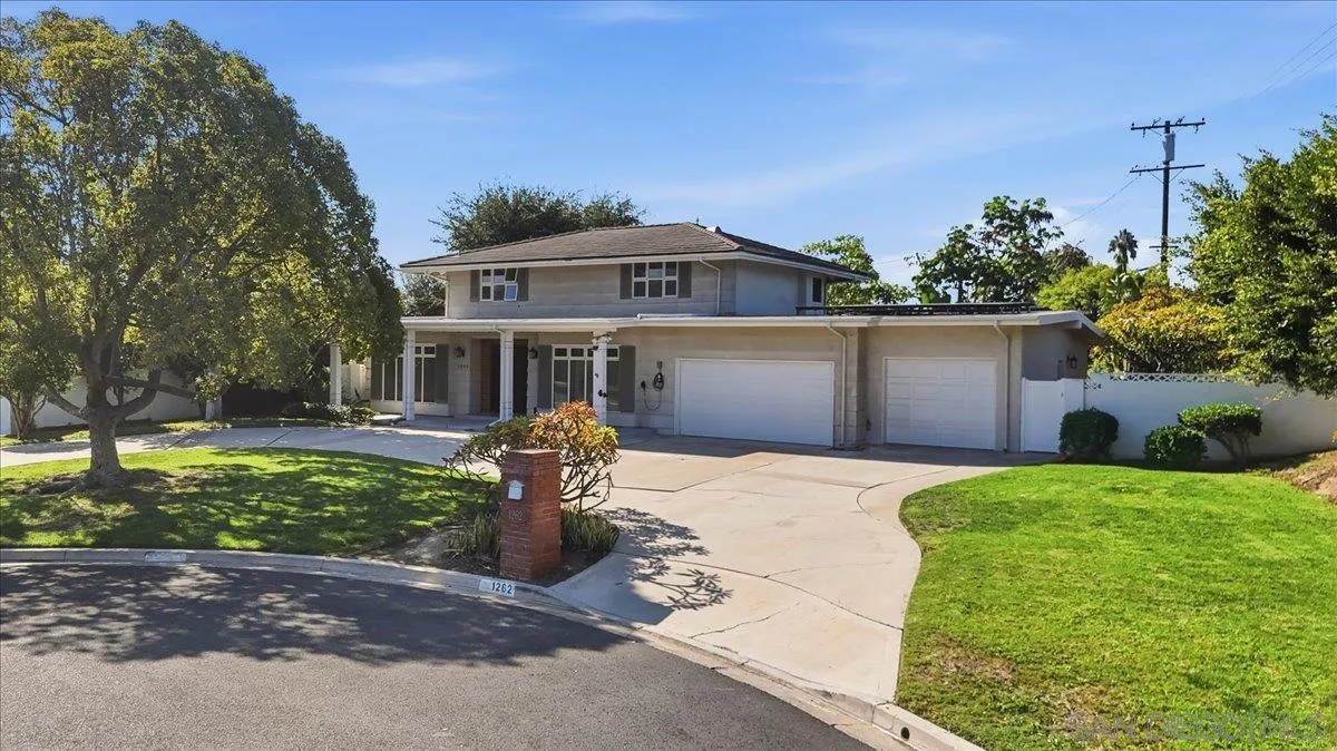 1262 Brittany Cross Road North Tustin, CA 92705 - Photo 31 of 35 a front view of a house with a yard and garage