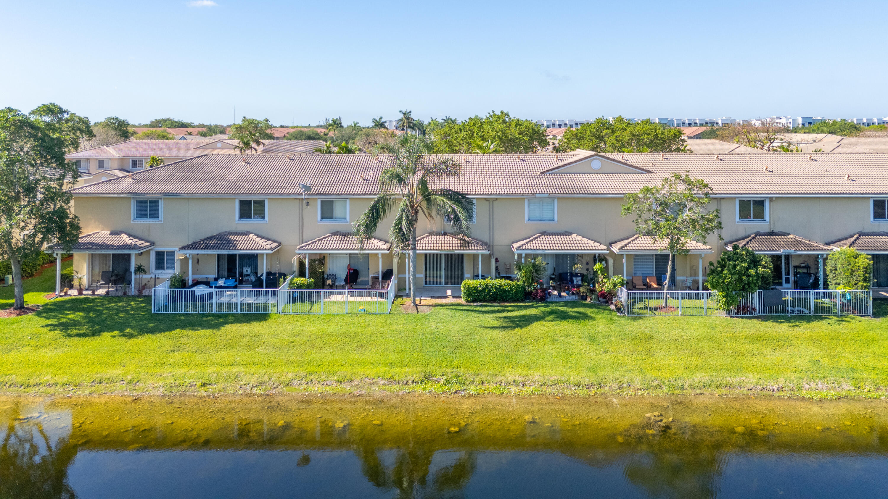 9107 Chambers Street, Unit 9107 Tamarac, FL 33321 - Photo 14 of 30 a view of a house with swimming pool and sitting area