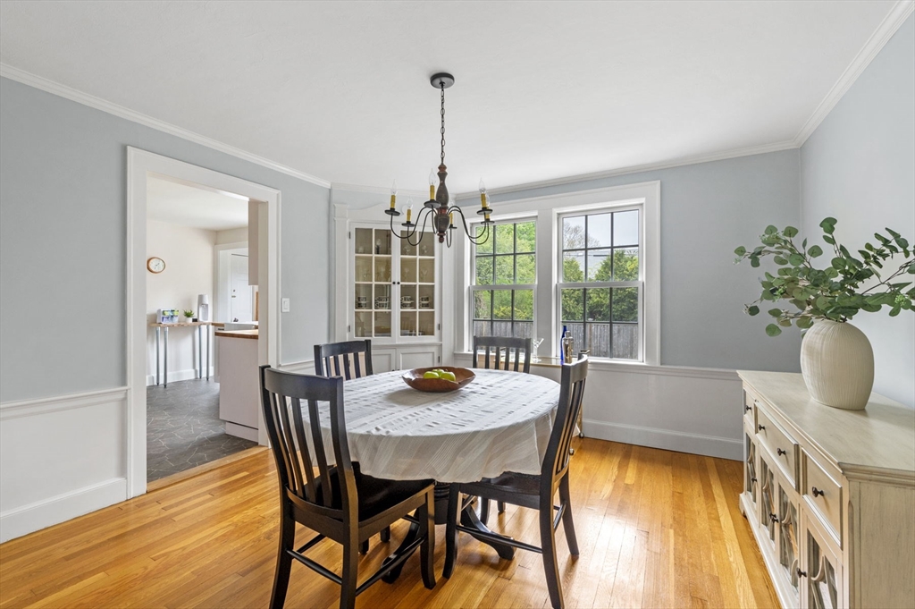 30 Rose Avenue Marblehead, MA 01945 - Photo 11 of 42 a dining room with furniture potted plants and wooden floor