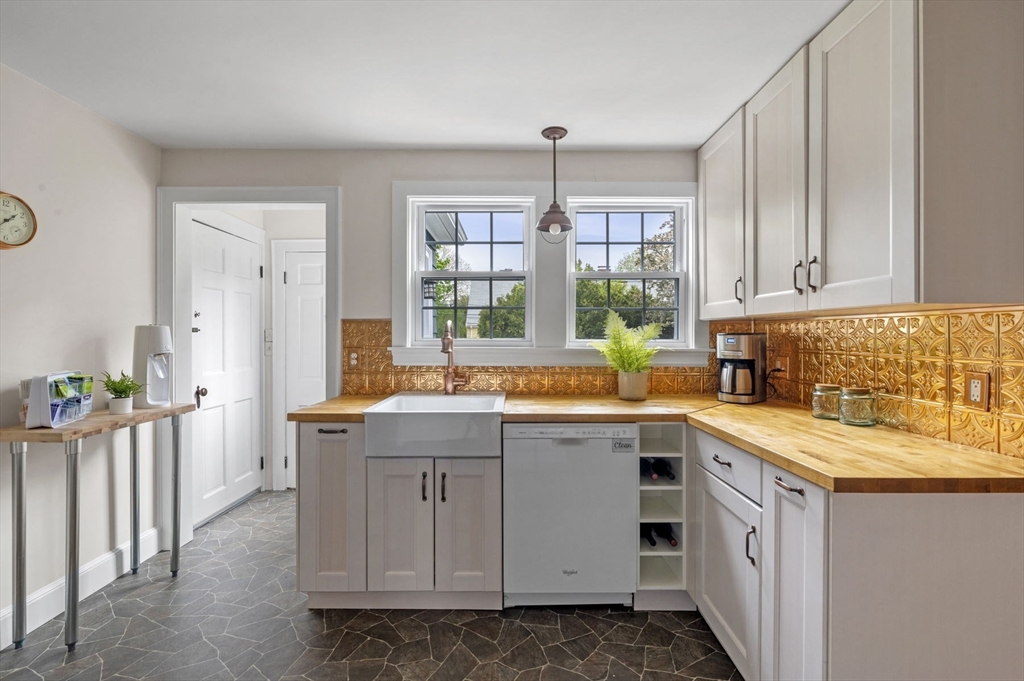 30 Rose Avenue Marblehead, MA 01945 - Photo 15 of 42 a kitchen with a sink stove and cabinets