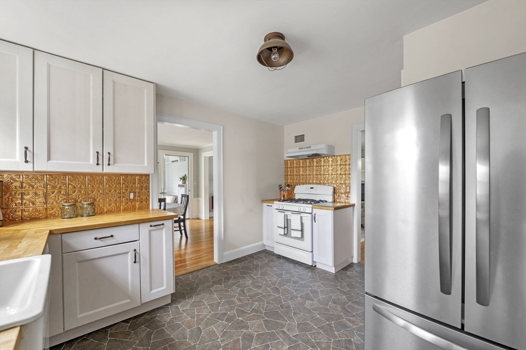 30 Rose Avenue Marblehead, MA 01945 - Photo 16 of 42 a kitchen with white cabinets and refrigerator