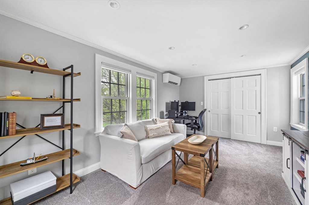30 Rose Avenue Marblehead, MA 01945 - Photo 23 of 42 a living room with furniture a flat screen tv and a window