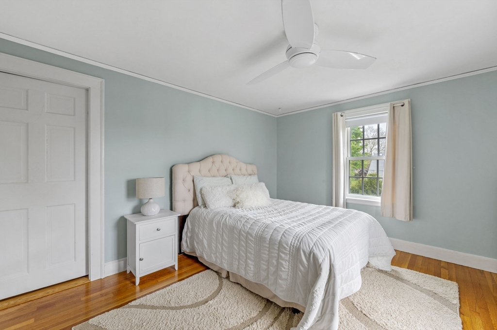 30 Rose Avenue Marblehead, MA 01945 - Photo 29 of 42 a bedroom with a bed and wooden floor