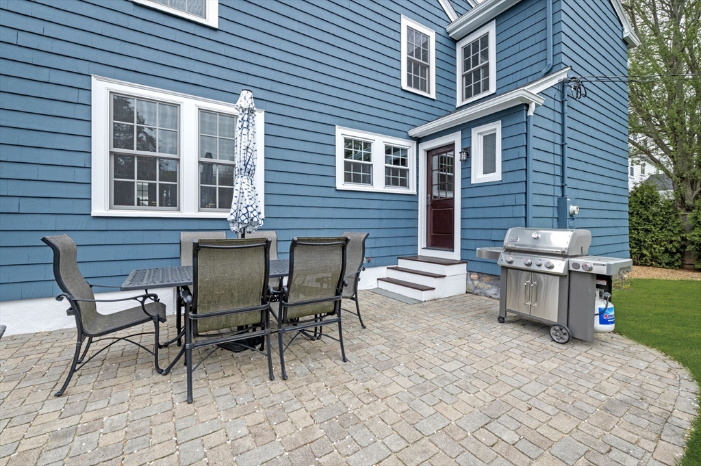 30 Rose Avenue Marblehead, MA 01945 - Photo 39 of 42 a view of a patio with table and chairs and a barbeque