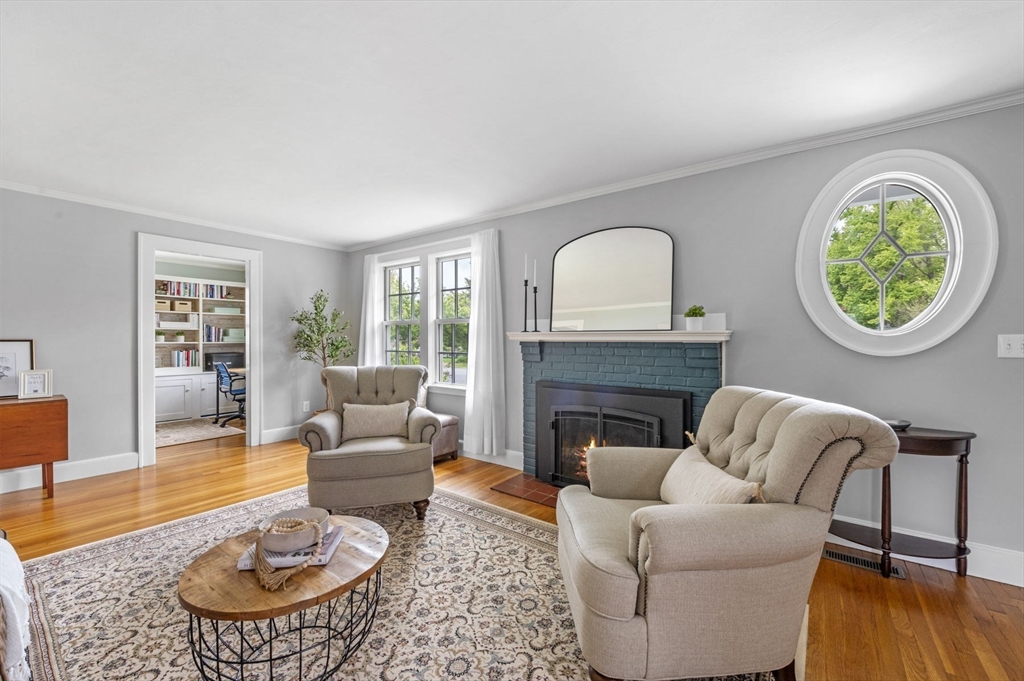 30 Rose Avenue Marblehead, MA 01945 - Photo 6 of 42 a living room with furniture a rug a fireplace and a window