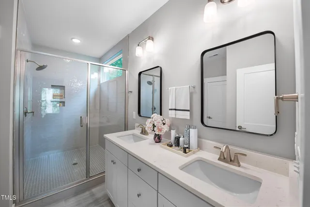 a bathroom with a glass shower door
