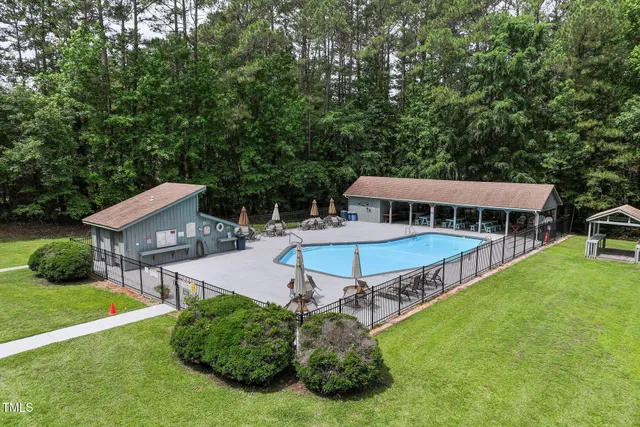 a view of yard with swimming pool