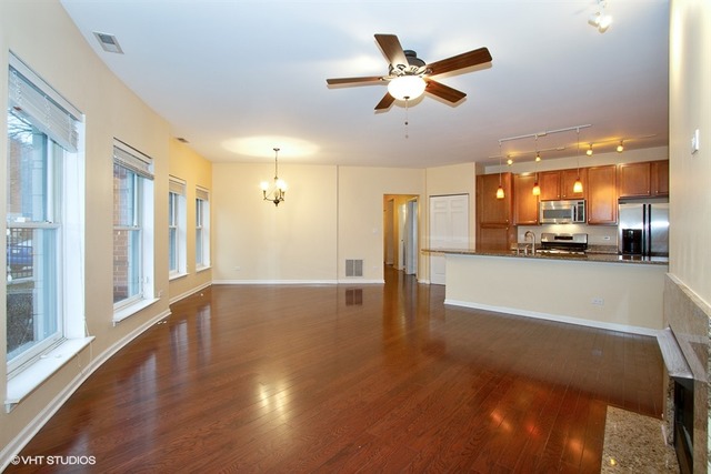 1450 South Halsted Street, Unit 1A Chicago, IL 60607 - Photo 3 of 11 a view of a livingroom with a kitchen