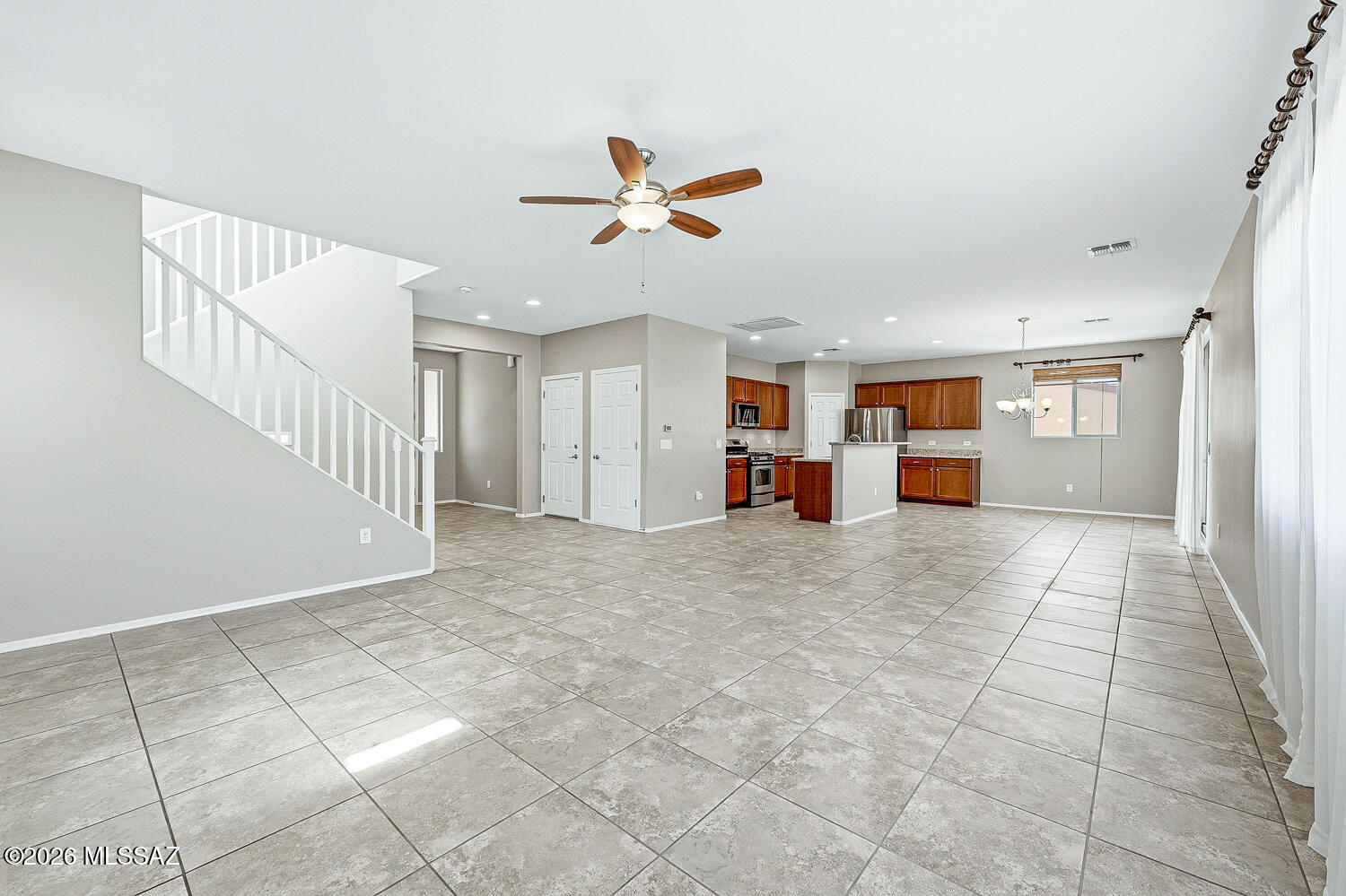 323 East Refuge Loop Vail, AZ 85641 - Photo 4 of 51 a view of a livingroom with furniture and a ceiling fan