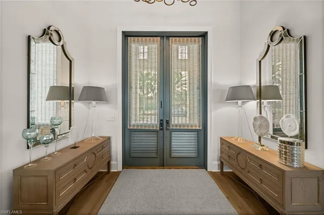 a bathroom with a double vanity sink and mirror