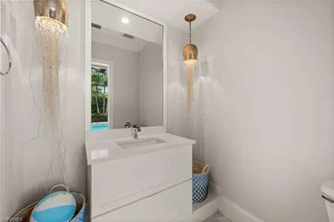 a utility room with sink dryer and washer