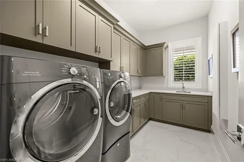 a view of a backyard with pool table and chairs