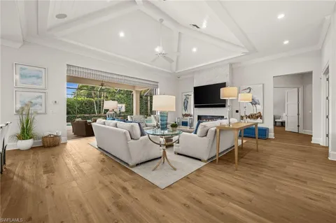 a living room with fireplace furniture and a flat screen tv
