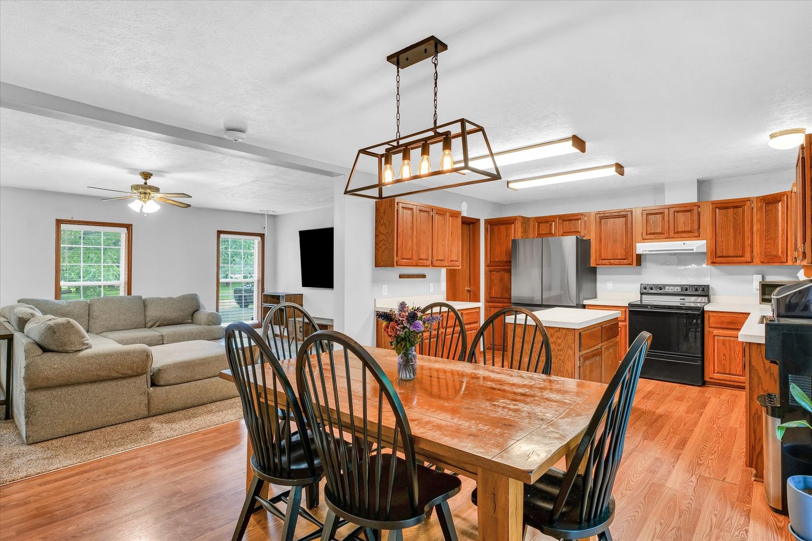7795 Buttercup Road Weldon, IL 61882 - Photo 12 of 47 a dining room with furniture a rug and wooden floor