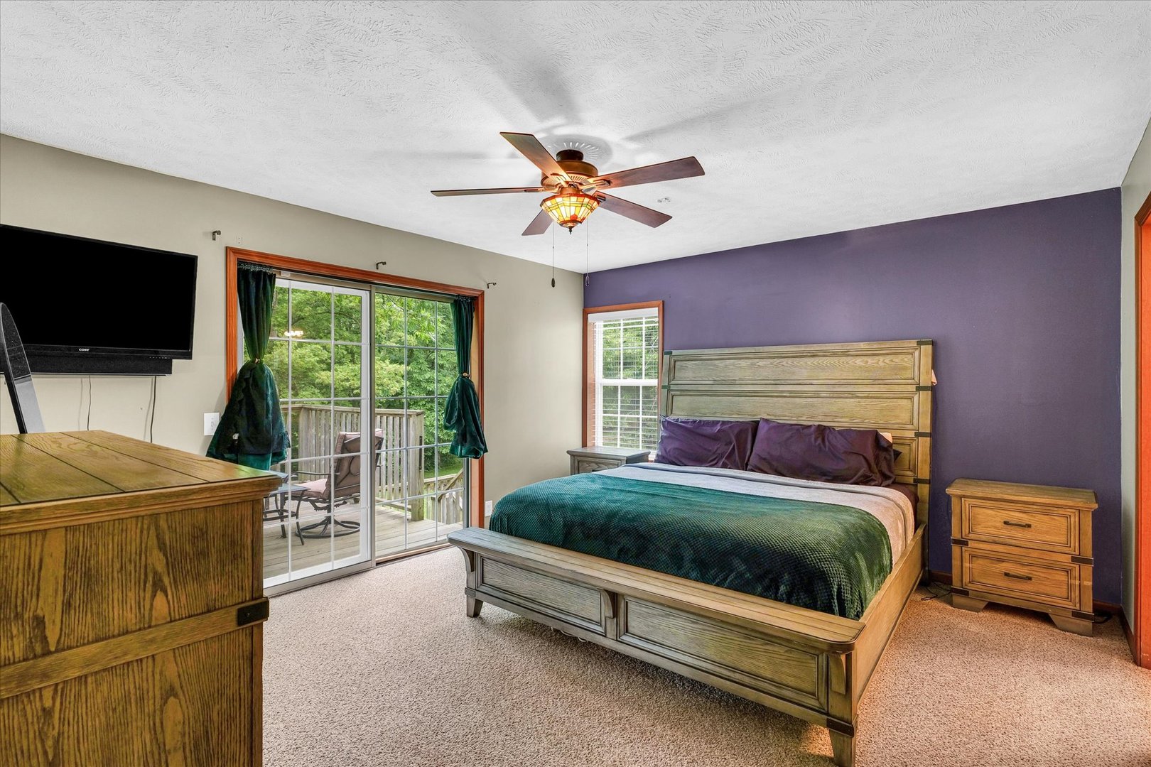 7795 Buttercup Road Weldon, IL 61882 - Photo 18 of 47 a bedroom with a bed and a television