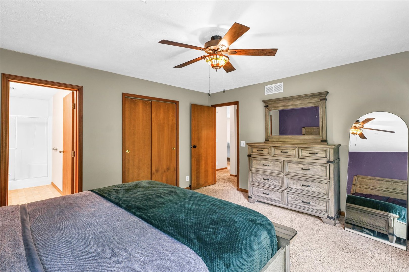 7795 Buttercup Road Weldon, IL 61882 - Photo 19 of 47 a bedroom with a bed and a chandelier