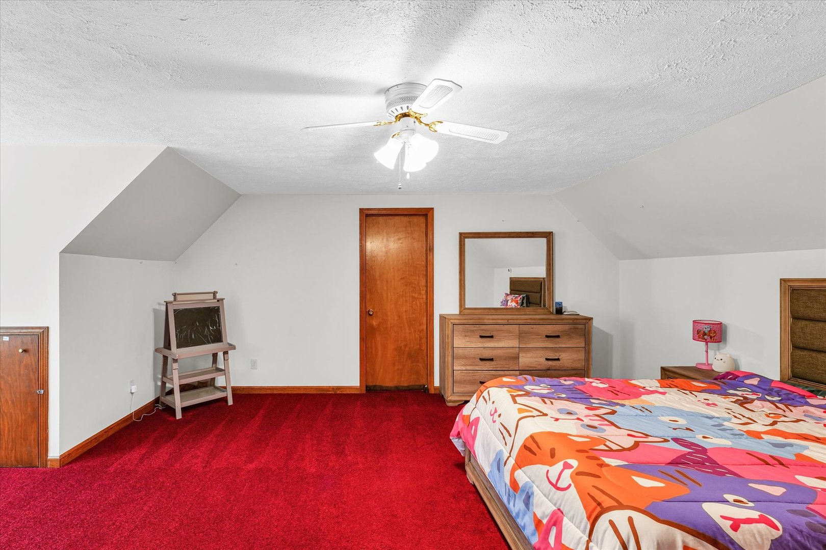 7795 Buttercup Road Weldon, IL 61882 - Photo 27 of 47 a bedroom with a bed and a chandelier