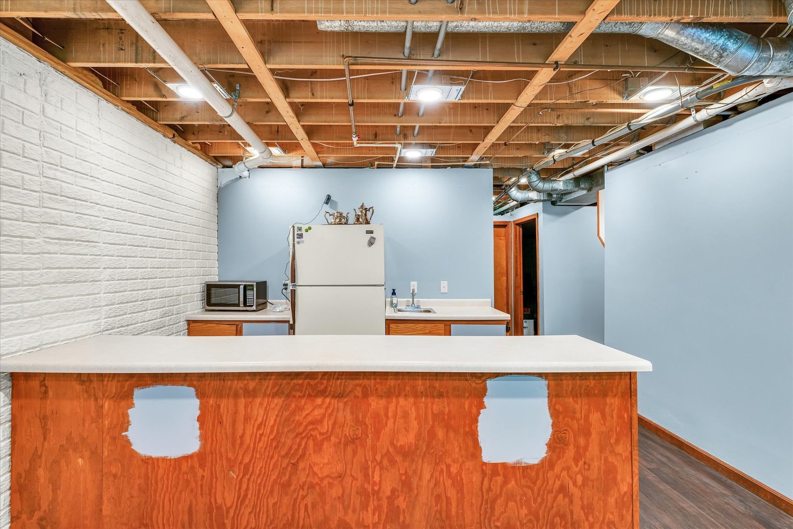 7795 Buttercup Road Weldon, IL 61882 - Photo 34 of 47 a view of kitchen with furniture and wooden floor