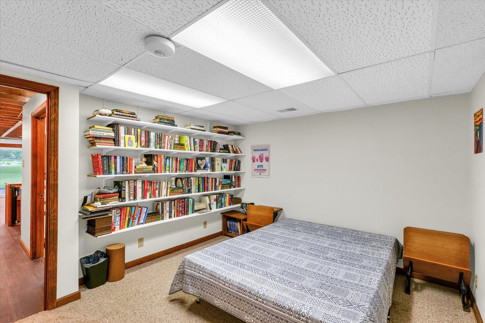 7795 Buttercup Road Weldon, IL 61882 - Photo 37 of 47 a bedroom with furniture and a book shelf