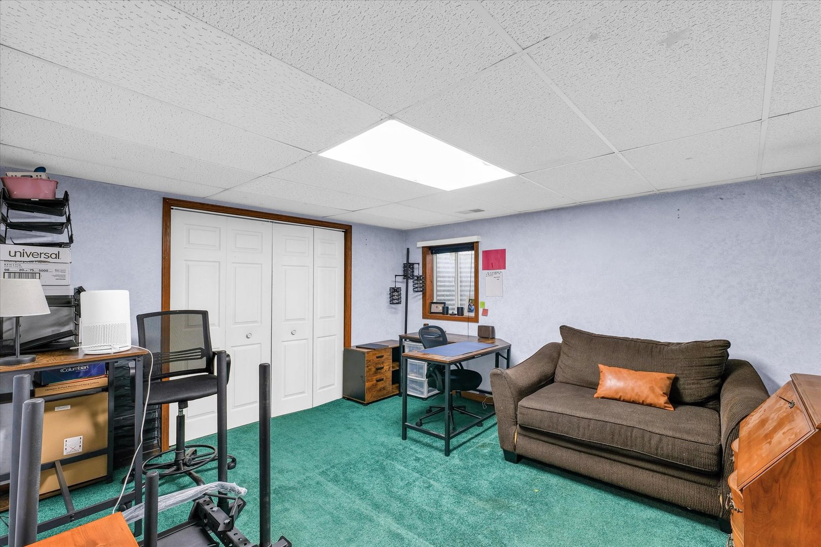 7795 Buttercup Road Weldon, IL 61882 - Photo 38 of 47 a living room with furniture and a flat screen tv