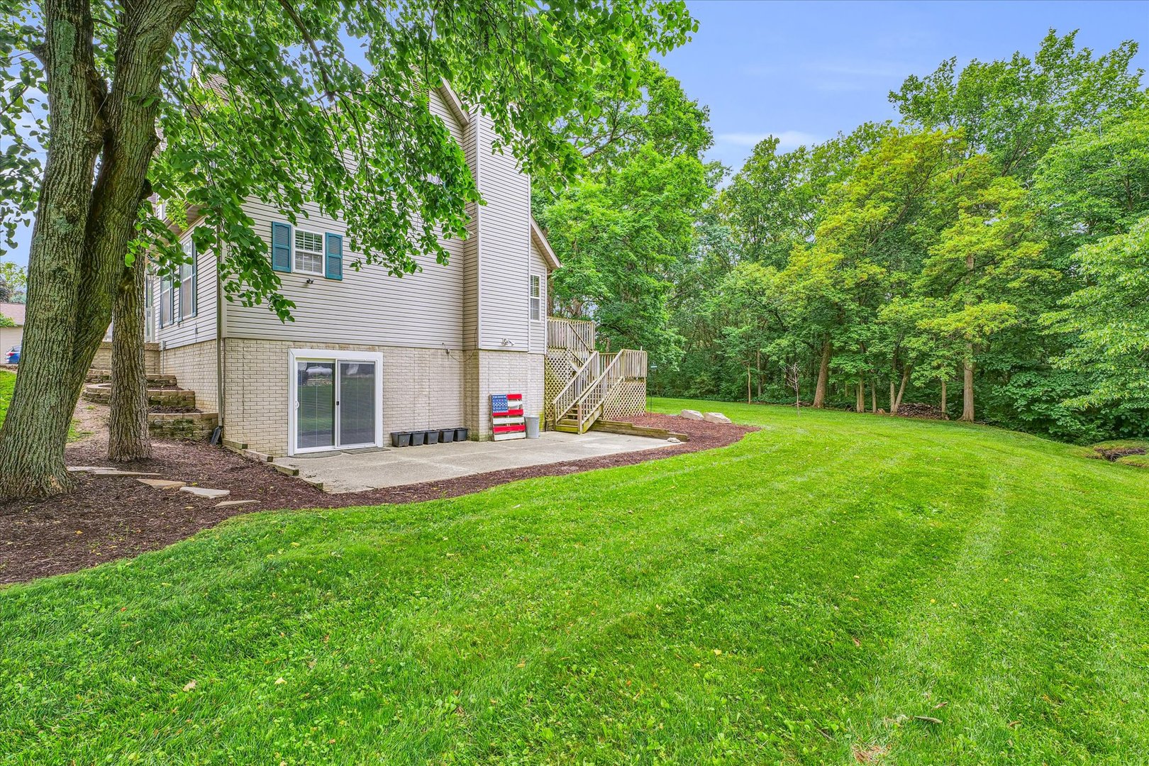 7795 Buttercup Road Weldon, IL 61882 - Photo 41 of 47 a view of house with backyard and a tree