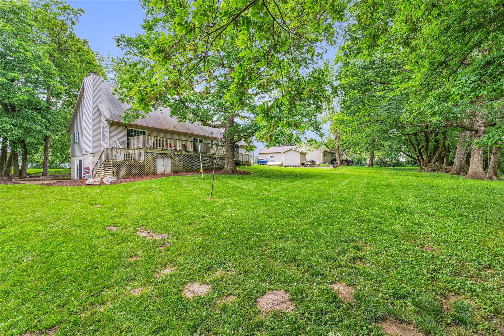 7795 Buttercup Road Weldon, IL 61882 - Photo 42 of 47 a view of a house with a yard and sitting area