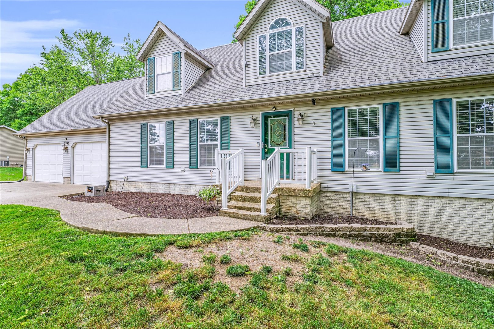 7795 Buttercup Road Weldon, IL 61882 - Photo 6 of 47 a front view of a house with garden