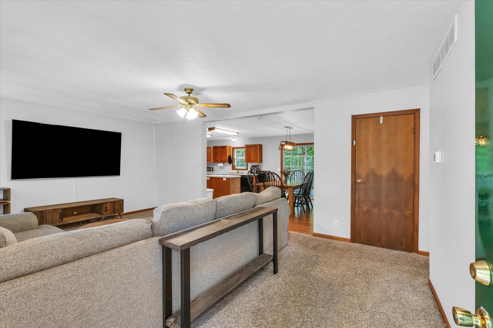 7795 Buttercup Road Weldon, IL 61882 - Photo 7 of 47 a living room with furniture and a flat screen tv
