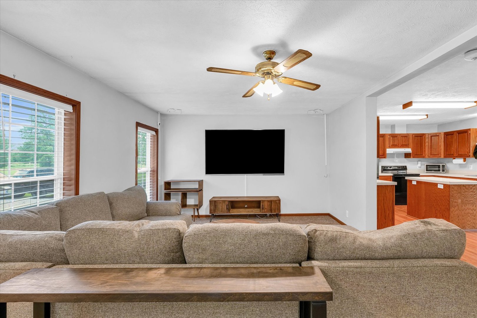 7795 Buttercup Road Weldon, IL 61882 - Photo 10 of 47 a living room with furniture and a flat screen tv