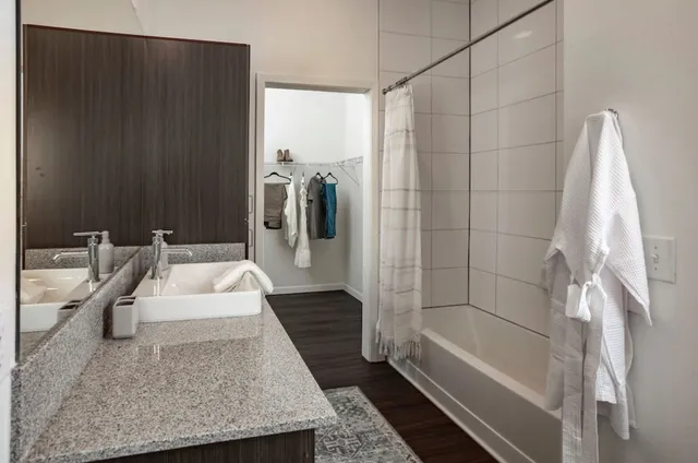 a bathroom with a bathtub and a shower