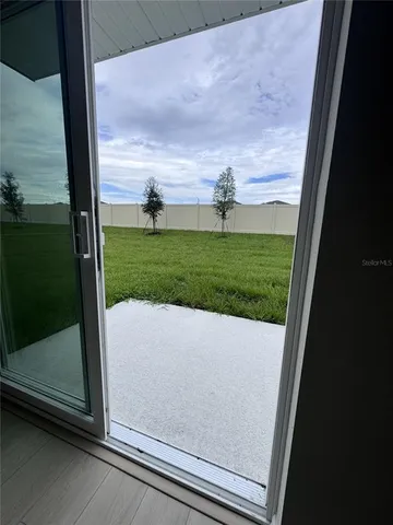 a view of a park with large trees