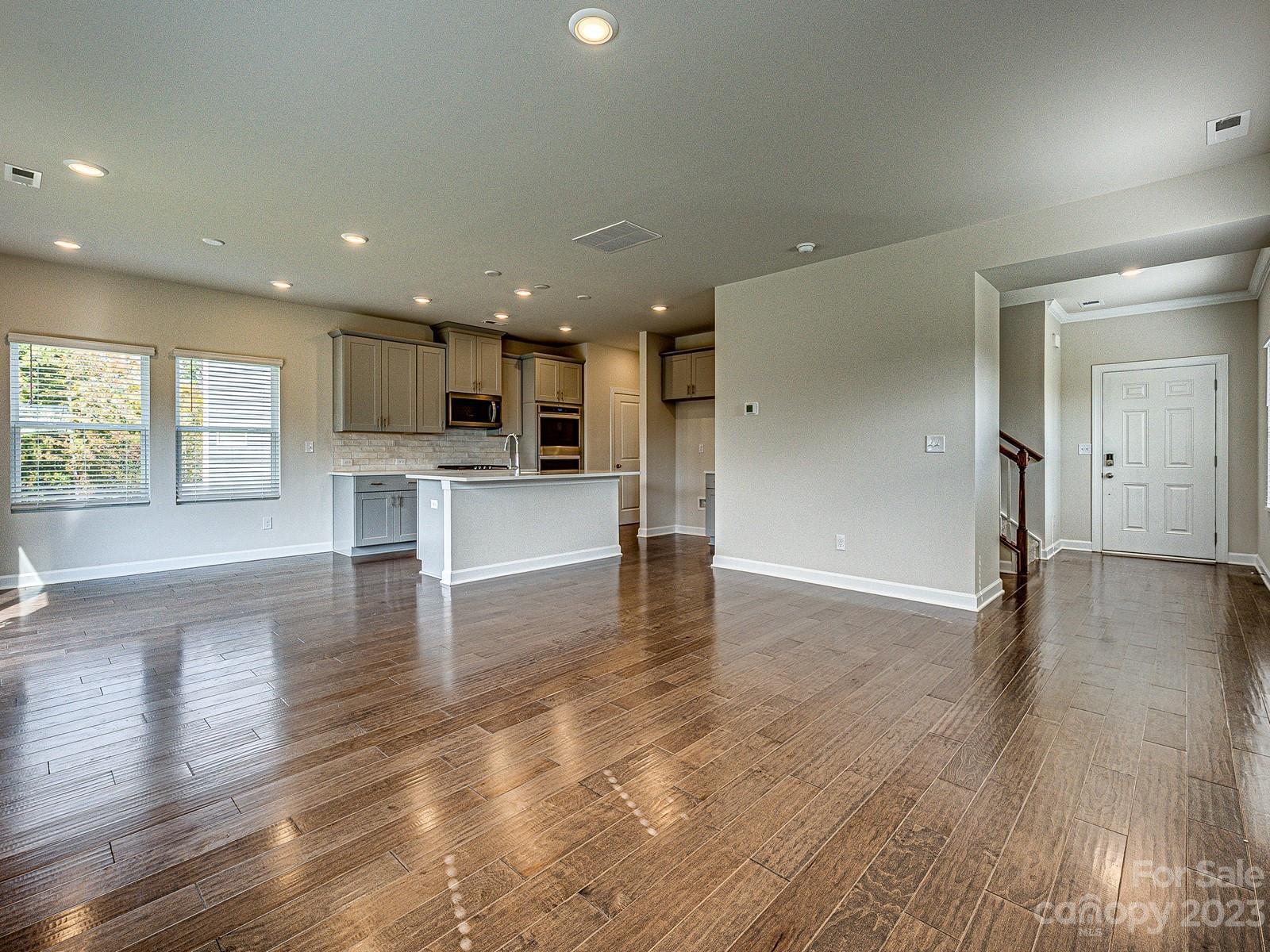 664 Citriadora Street Fort Mill, SC 29715 - Photo 12 of 27 a view of kitchen with cabinets and wooden floor