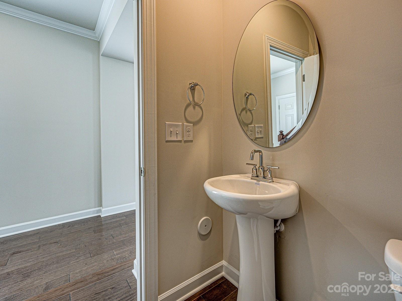 664 Citriadora Street Fort Mill, SC 29715 - Photo 13 of 27 a bathroom with a sink and mirror