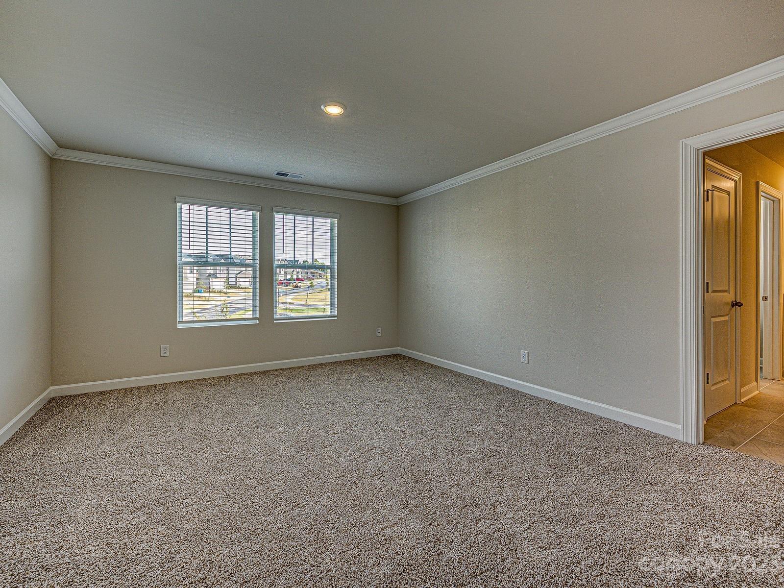 664 Citriadora Street Fort Mill, SC 29715 - Photo 16 of 27 an empty room with windows
