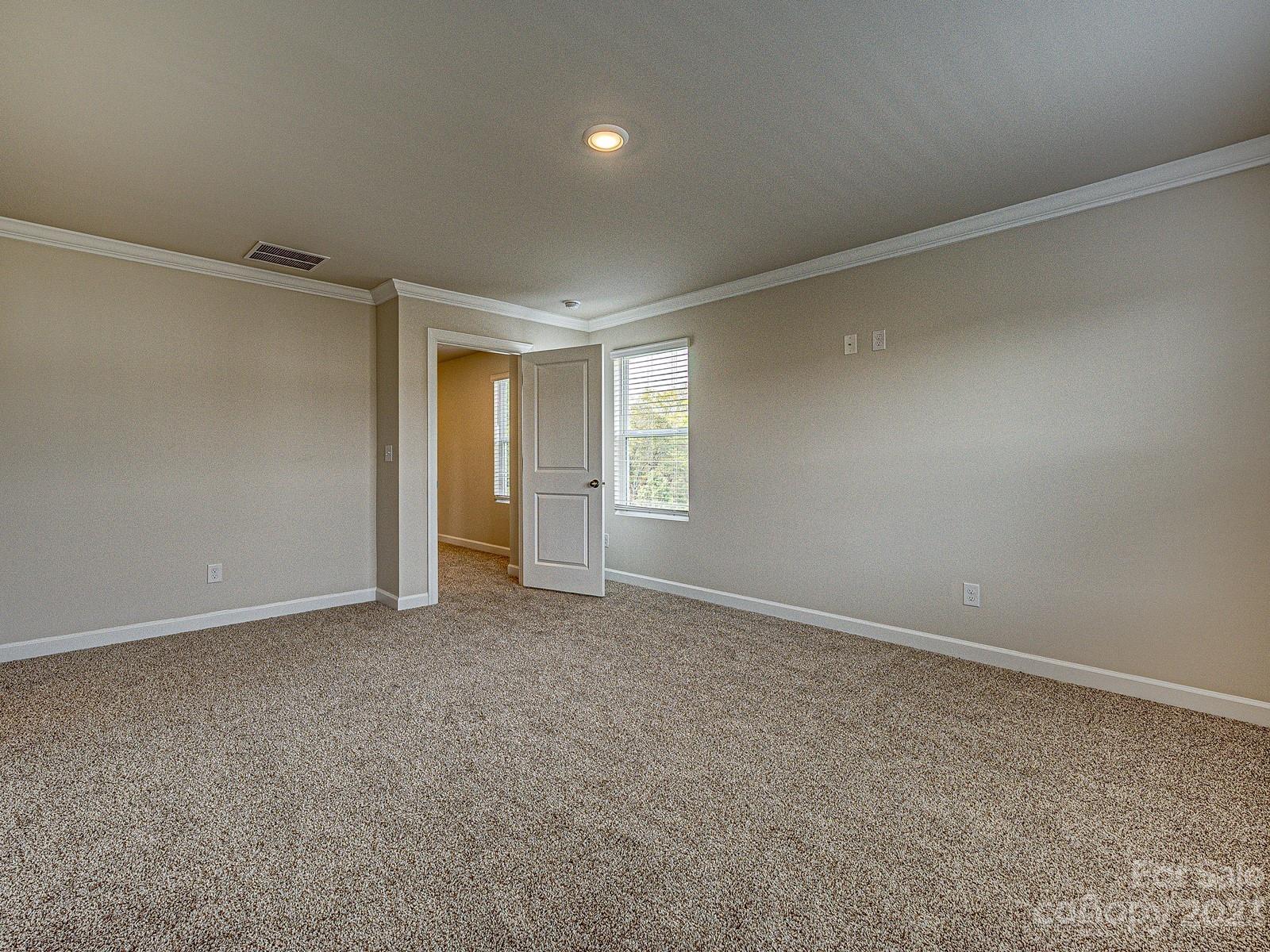 664 Citriadora Street Fort Mill, SC 29715 - Photo 17 of 27 a view of an empty room and a window
