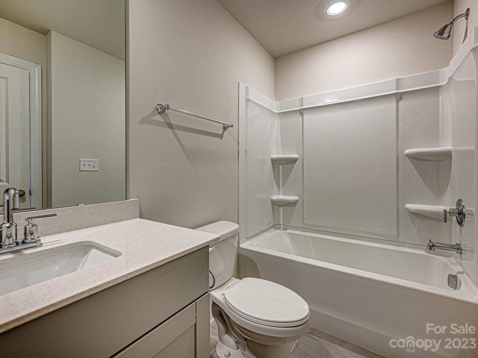 664 Citriadora Street Fort Mill, SC 29715 - Photo 20 of 27 a bathroom with a sink a toilet and a bathtub