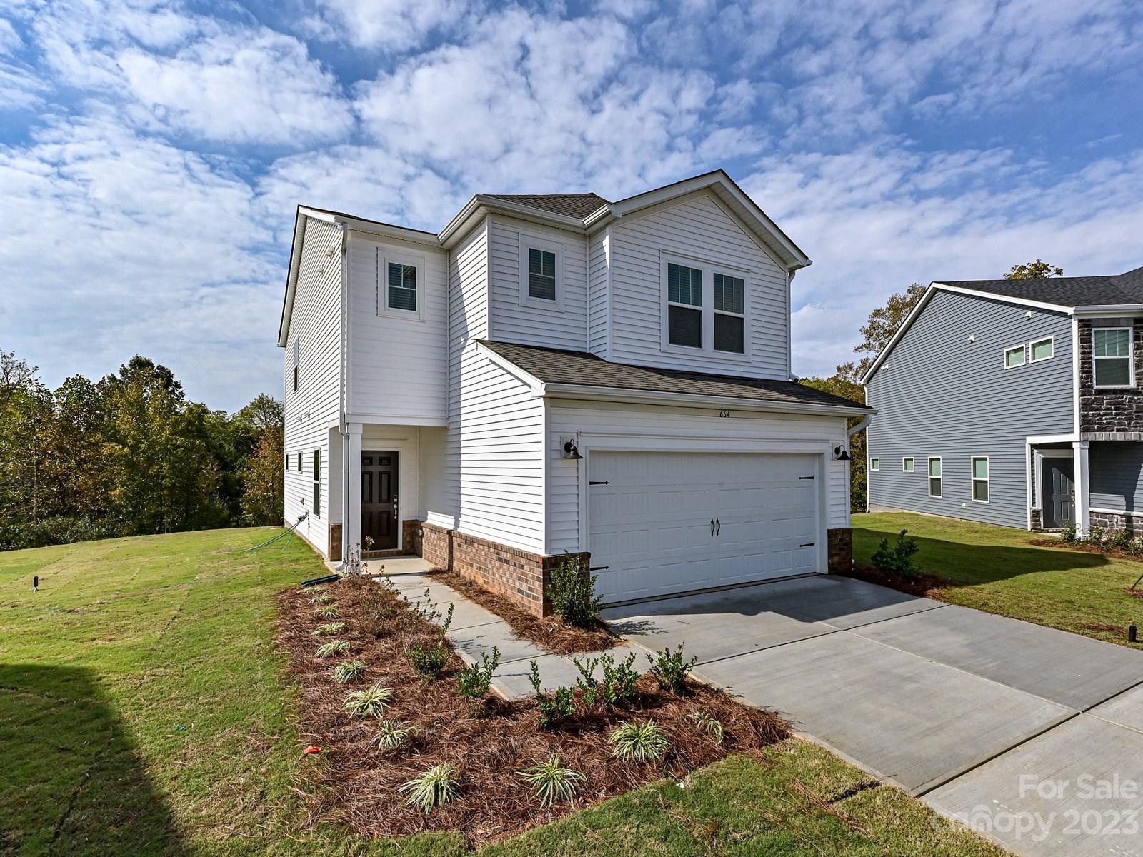 664 Citriadora Street Fort Mill, SC 29715 - Photo 2 of 27 a front view of a house with a yard