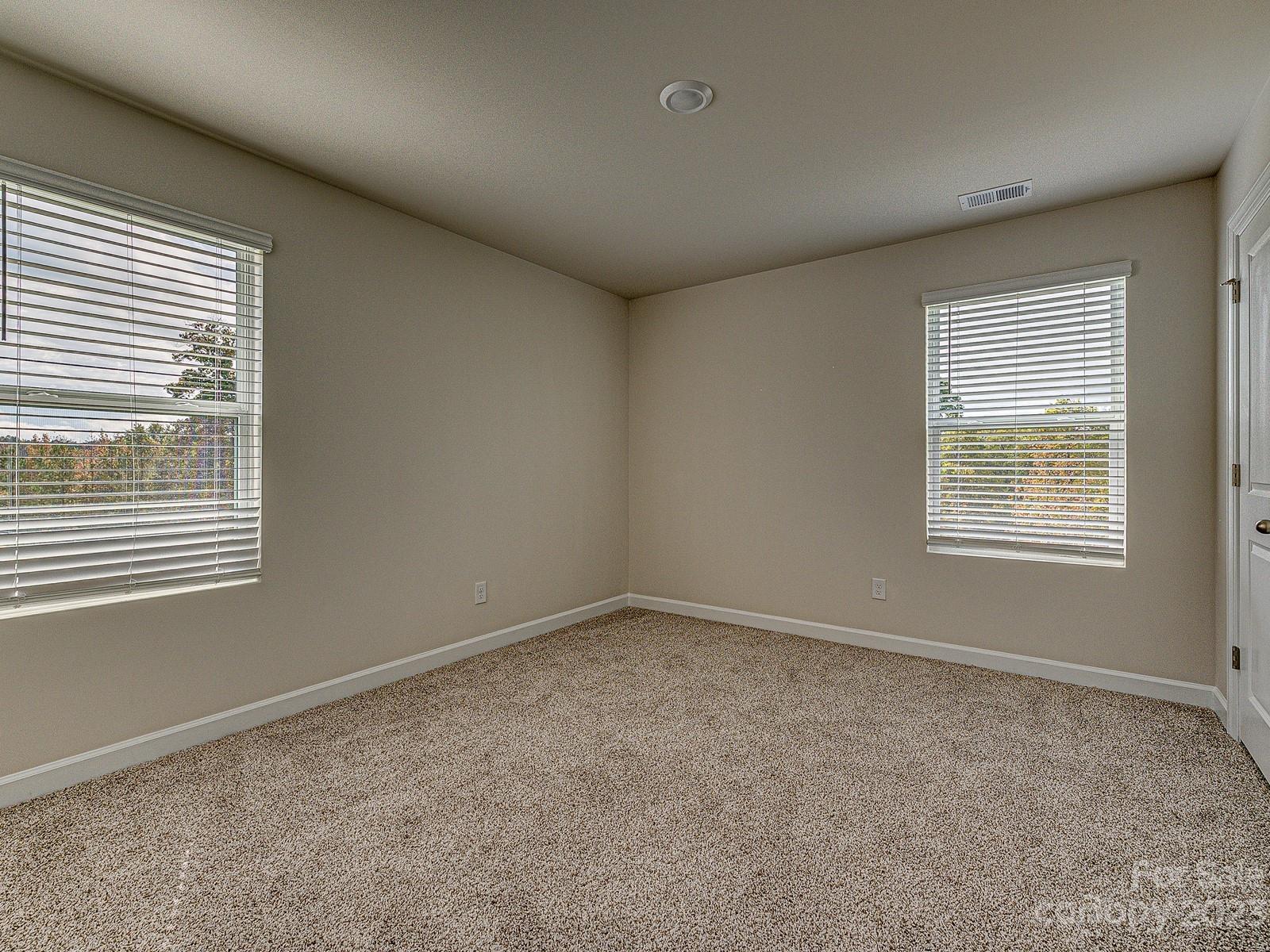 664 Citriadora Street Fort Mill, SC 29715 - Photo 21 of 27 an empty room with a window