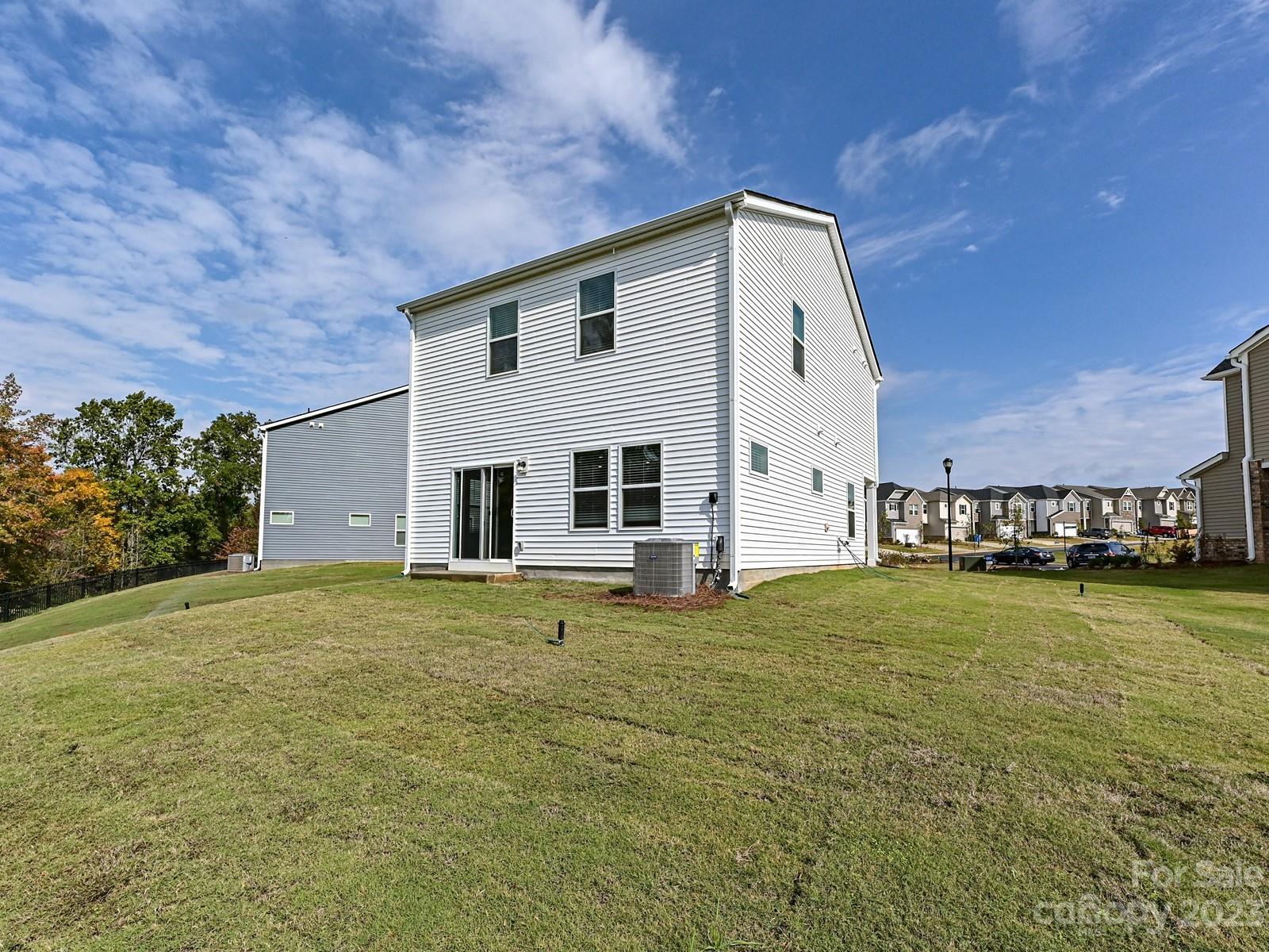 664 Citriadora Street Fort Mill, SC 29715 - Photo 24 of 27 a view of a house with a yard