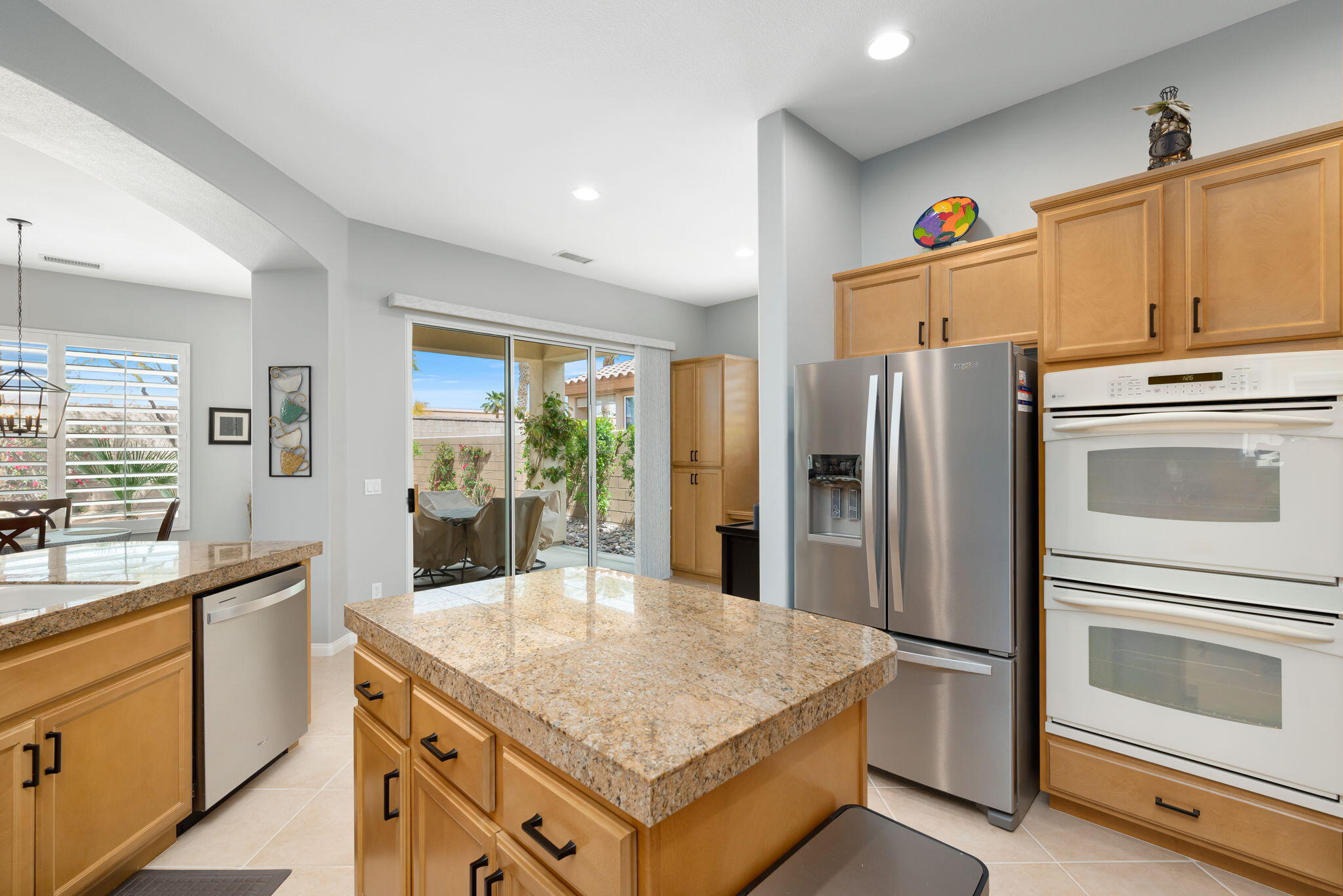 81768 Daniel Drive La Quinta, CA 92253 - Photo 15 of 81 a kitchen with refrigerator cabinets and wooden floor