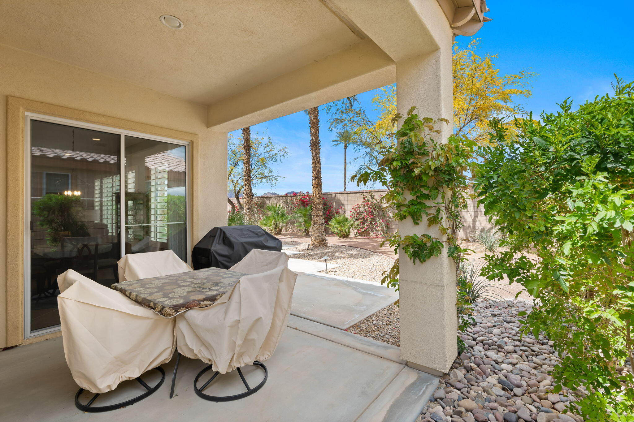 81768 Daniel Drive La Quinta, CA 92253 - Photo 29 of 81 a living room with furniture and a potted plant