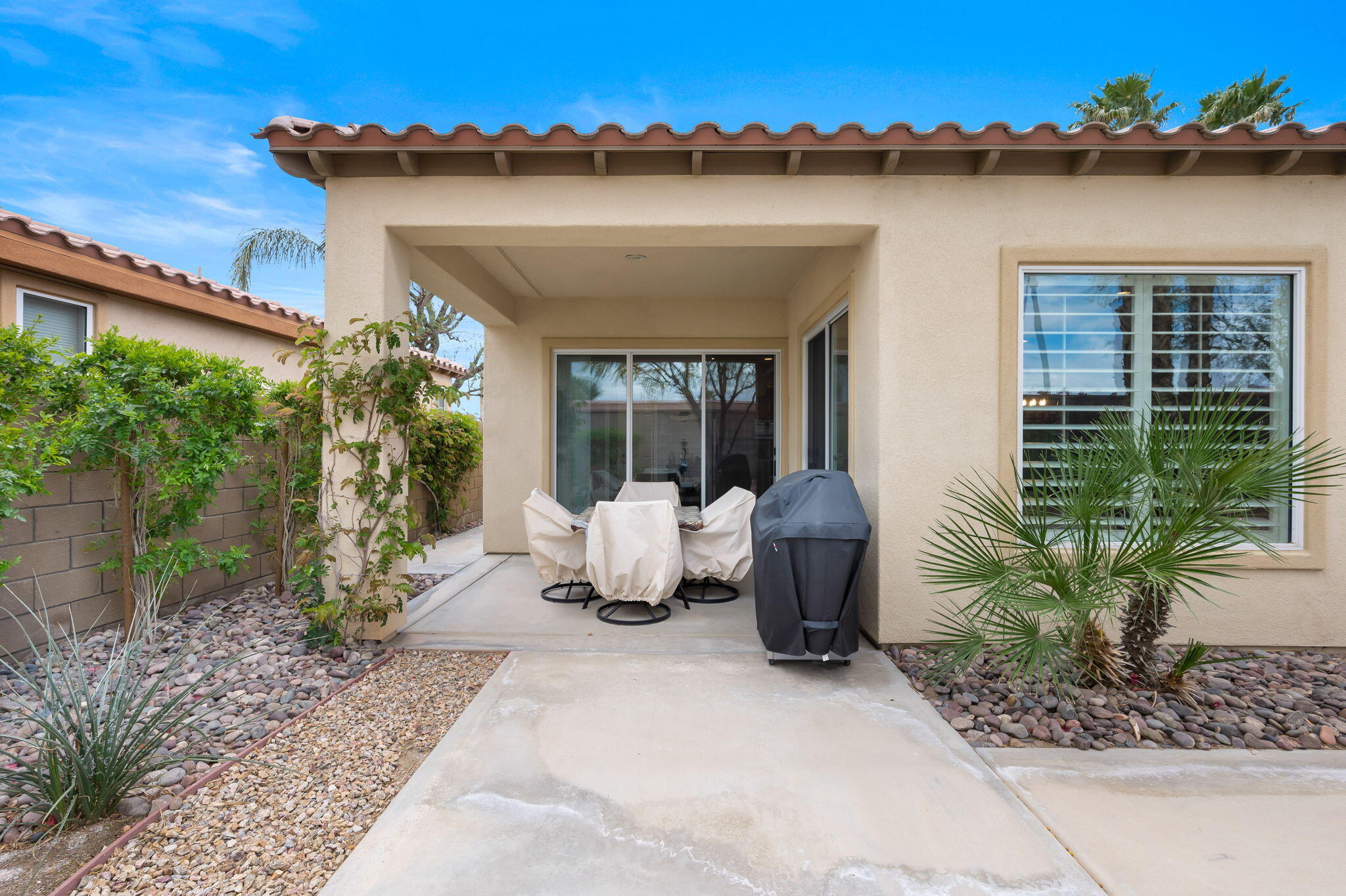 81768 Daniel Drive La Quinta, CA 92253 - Photo 31 of 81 a view of a porch with furniture and floor to ceiling window