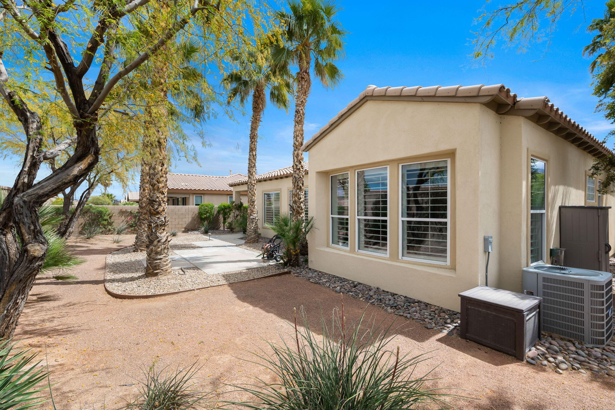 81768 Daniel Drive La Quinta, CA 92253 - Photo 34 of 81 a view of a house with backyard and sitting area