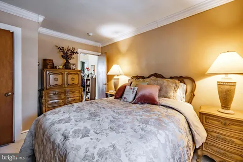 a bedroom with bed and a window