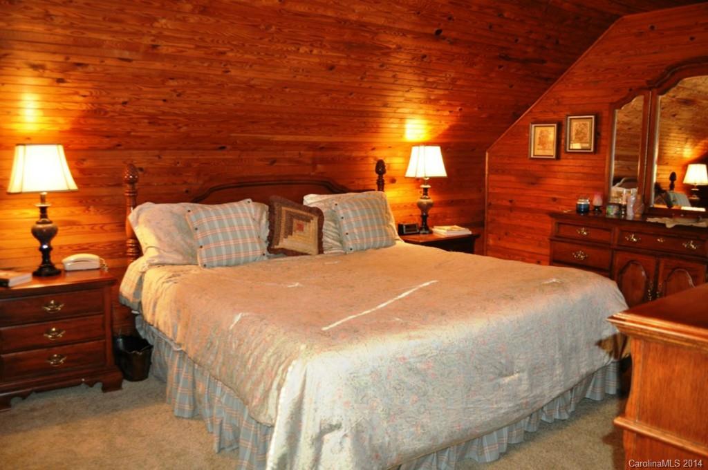 5930 Pagemont Road Kannapolis, NC 28081 - Photo 13 of 24 a large bed sitting in a bedroom next to a larger window