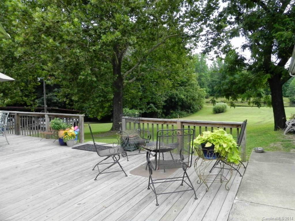 5930 Pagemont Road Kannapolis, NC 28081 - Photo 22 of 24 a view of a chairs and table on the wooden deck