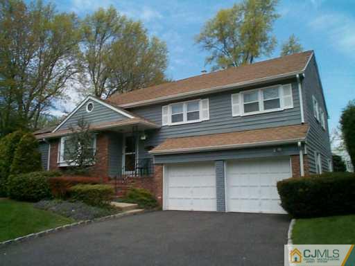 22 Chandler Road Edison, NJ 08820 - Photo 2 of 8 a front view of a house with garage