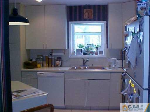 22 Chandler Road Edison, NJ 08820 - Photo 8 of 8 a kitchen with a sink cabinets and window