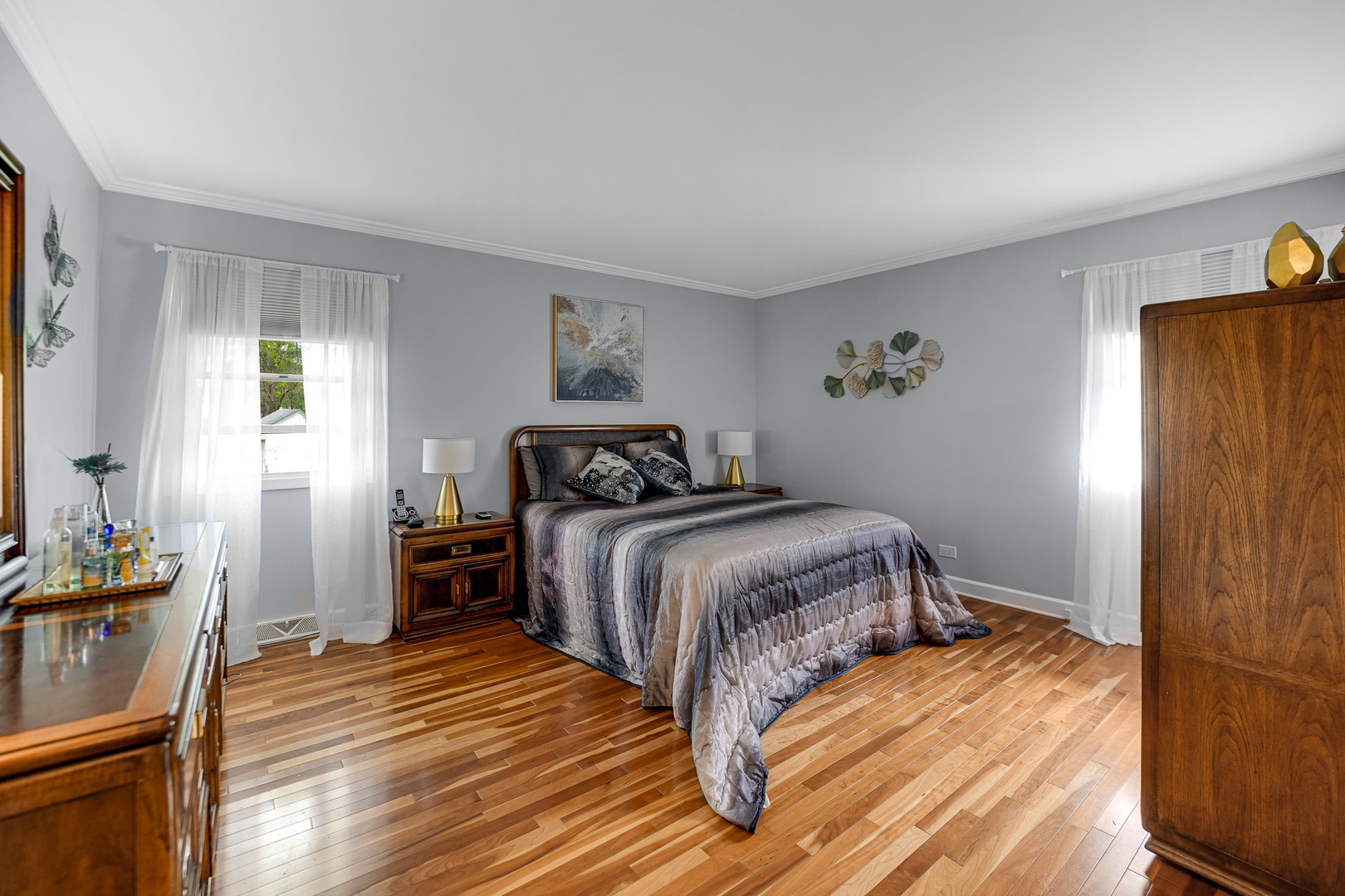 920 Harrison Lane Hoffman Estates, IL 60192 - Photo 11 of 26 a bedroom with a bed and wooden floor
